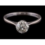 An 18ct white gold and diamond solitaire ring: the round old brilliant-cut diamond approximately 6.