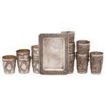 A set of six Chinese silver beakers, unmarked: with floral and insect decoration, 5cm.