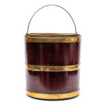 A George III mahogany and brass bound bucket: of cylindrical form with brass loop carrying handle