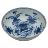 A Chinese blue and white porcelain small bowl: painted with a duck swimming amongst lotus flowers