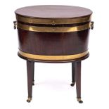 A George III mahogany and brass bound oval wine cooler: on stand,