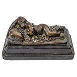 A 19th Century bronze study of a sleeping putto: his head on a pillow and partially covered by a