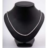 A graduated diamond line necklace: comprising 212 round,