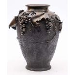 A large Japanese bronze vase: of ovoid form decorated with vine leaves and bunches of grapes,