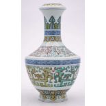 A Chinese doucai vase: of archaic form with waisted slender neck,