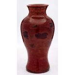 A Chinese Beijing 'Realgar' glass vase: of baluster form, the marbled red,
