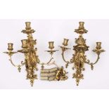 A pair of Victorian brass four-light wall sconces: with cartouche-shaped and scroll decorated