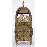 A brass lantern clock signed A.