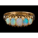 An 18ct gold and opal five-stone ring: set with graduated oval opals,