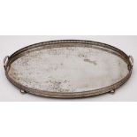 A silver plated serving tray: of rectangular outline with moulded border and loop carrying handles