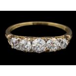 A graduated diamond five-stone ring: with round old brilliant-cut diamonds estimated to weigh a