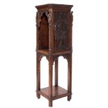A Victorian Gothic carved oak square open pedestal cabinet:, the top with cut corners,