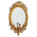 A 19th Century giltwood and gesso oval girandole mirror:,