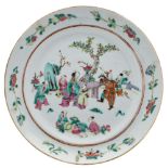A Chinese famille rose dish: painted with a garden scene with figures around a table,