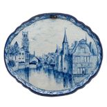 A pair of Tichelaar Makkum blue and white delftware topographical plaques: of cartouche form,