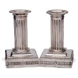A pair of Victorian silver column candlesticks, maker Goldsmiths & Silversmiths Co, Sheffield,