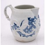 A First Period Worcester blue and white barrel-shaped cream jug: with double scroll handle and