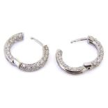 A pair of 18ct white gold and diamond hoop earrings: pave-set throughout with brilliant-cut