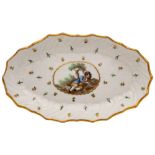 A Caughley spoon tray with painting attributed to Fidelle Duvivier: of spirally fluted oval form,