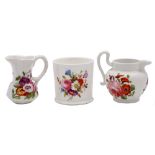 Two mid 19th century English porcelain miniature jugs and a similar mug: each painted with floral
