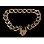A gold curb-link bracelet: with attached 9ct gold heart-shaped padlock clasp,