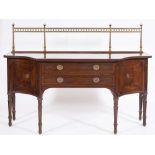 A late 19th Century mahogany, crossbanded and inlaid sideboard: of shaped outline,