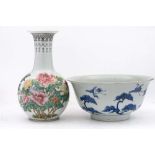 A Japanese blue and white bowl and a Chinese famille rose vase: the bowl with flared rim and