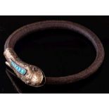 A mid 19th Century gold and turquoise mounted snake head hair bangle: with cabochon-set eyes,