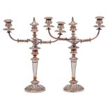 A pair of early 19th Century Sheffield Plate twin branch candelabra,