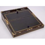 A Victorian coromandel and brass bound and strung writing box: the hinged lid enclosing a leather