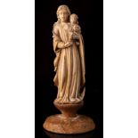 An Indo-Portuguese carved ivory group of the Virgin and Child: 18th/19th Century, 13cm.