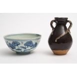 A Chinese blue and white bowl and a two-handled vase: the first painted with flowering stems,