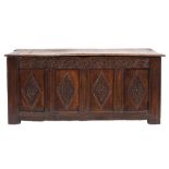 An early 18th Century oak rectangular coffer:, the plain hinged rectangular top with a moulded edge,