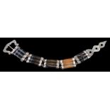 A 19th Century Scottish agate mounted bracelet: of strap and buckle form with five fluted banded