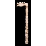 A late 19th century Cantonese carved ivory parasol handle: in the form of a dragon's head,