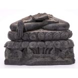 An Indian carved grey schist fragment: of the lower section of a seated Buddha with hands in