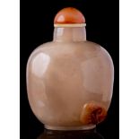 A Chinese agate snuff bottle: of mottled grey and russet colour carved with a single lingzhi spray,