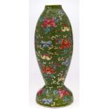 A Chinese famille rose vase and a Chinese green ground lamp base: the first painted with two