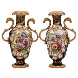 A pair of mid 19th century English porcelain vases: with ram's head scroll handles and moulded with