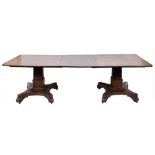 A William IV calamander wood twin pillar dining table:, the top with rounded corners,