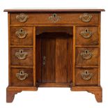 A mid 18th Century mahogany kneehole desk:, of small size, the top with a moulded edge,