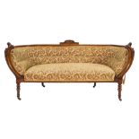 A Victorian carved walnut settee:,