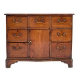 A George III mahogany serpentine fronted side cabinet:,