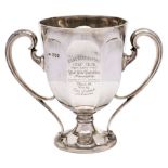 An Edward VII silver two handled trophy cup, maker Sibray, Hall & Co, Ltd, London, 1906: inscribed,