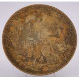 A Japanese brass dish: decorated in low relief with four figures below a seated Buddha with dragon