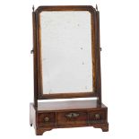 An 18th Century walnut and partly gilt swing frame platform toilet mirror:,