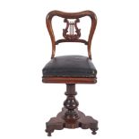A Harpist's Victorian carved rosewood revolving chair:,