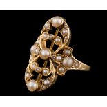 An early 20th Century gold and seed-pearl mounted 'along-the-finger' cluster ring: of openwork