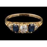 A sapphire and diamond five-stone ring: set with old brilliant-cut diamonds between oval sapphires