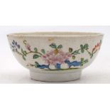 A Plymouth polychrome bowl: painted with peony sprays, an insect and pierced blue rockwork,